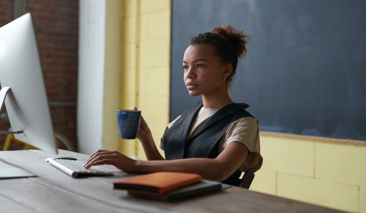 Woman works in front of a computer.